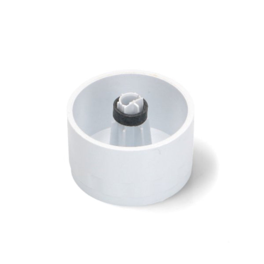 White plastic component with a black cap on a white background