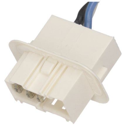Close-up of a white electrical connector with wires on a white background