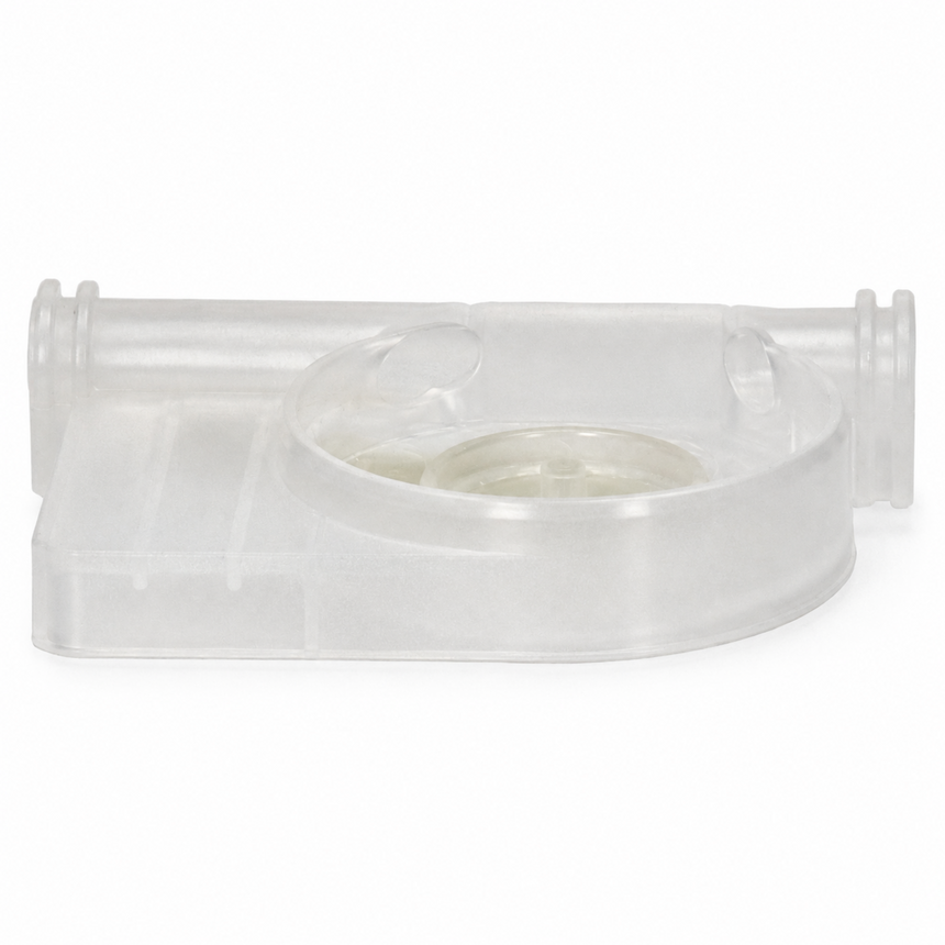 Clear plastic component on a white background