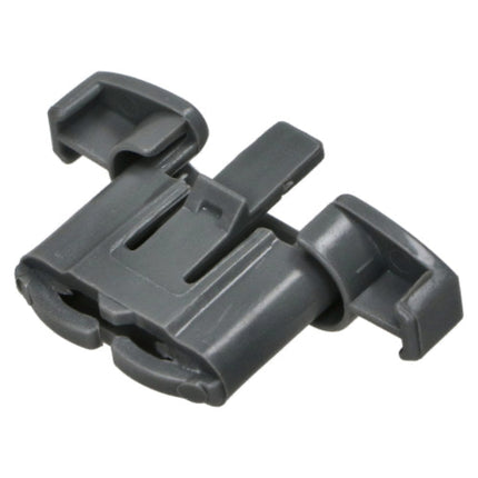 A dark gray plastic quick-release buckle or clip component, isolated on a white background.