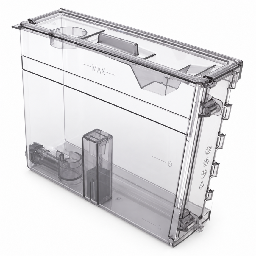 A transparent plastic refrigerator water tank with measurement markings and internal drain components, shown on a clean white background.