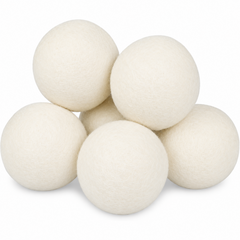 Six off-white wool felt cleaning balls arranged in a small pile on a white background.