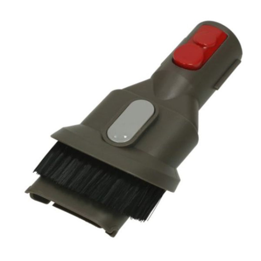 Car brush with red button and black bristles on a white background
