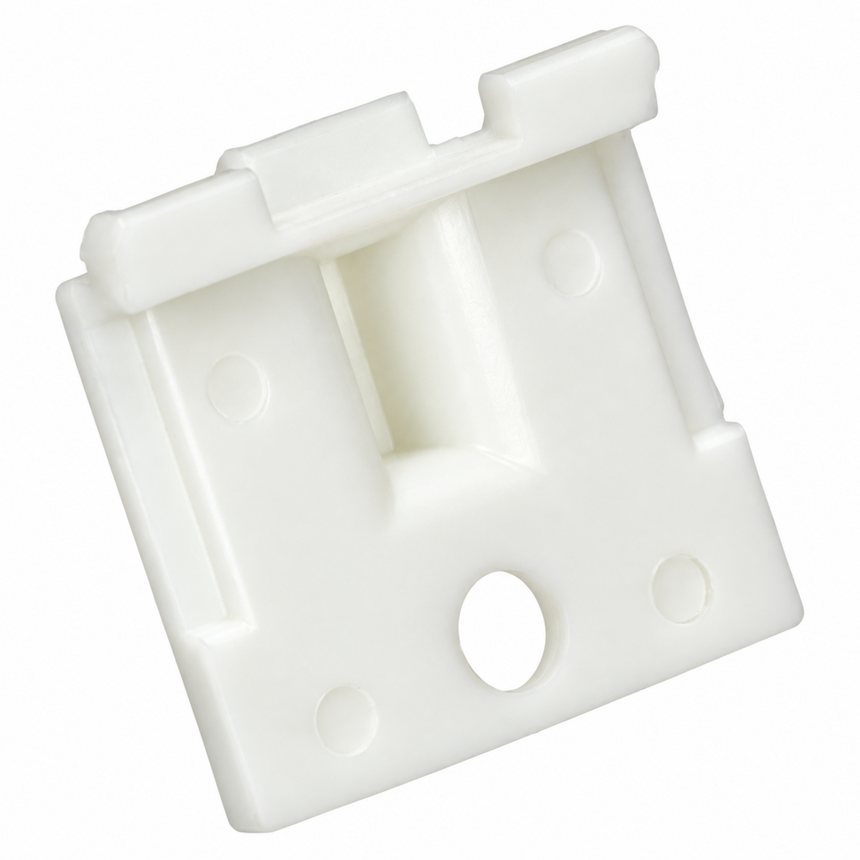 A white plastic door stopper or latch block with a rectangular shape, featuring a central recessed channel, circular mounting holes, and a small tab on top, shown on a plain white background.
