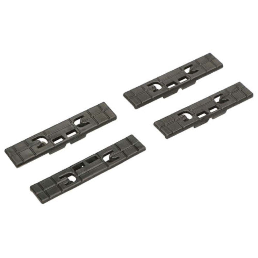 Four black plastic strips on a white background
