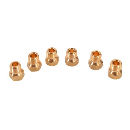 Set of six brass nozzles on a white background