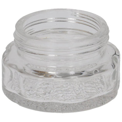 Clear glass jar with textured surface on a white background