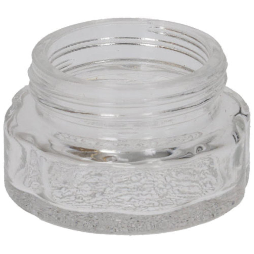Clear glass jar with textured surface on a white background