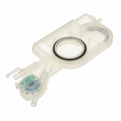 A translucent white plastic water reservoir tank with a black rubber O-ring and a small blue and green pump motor, shown on a solid white background.