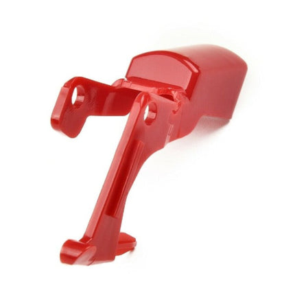 Red plastic component on a white background