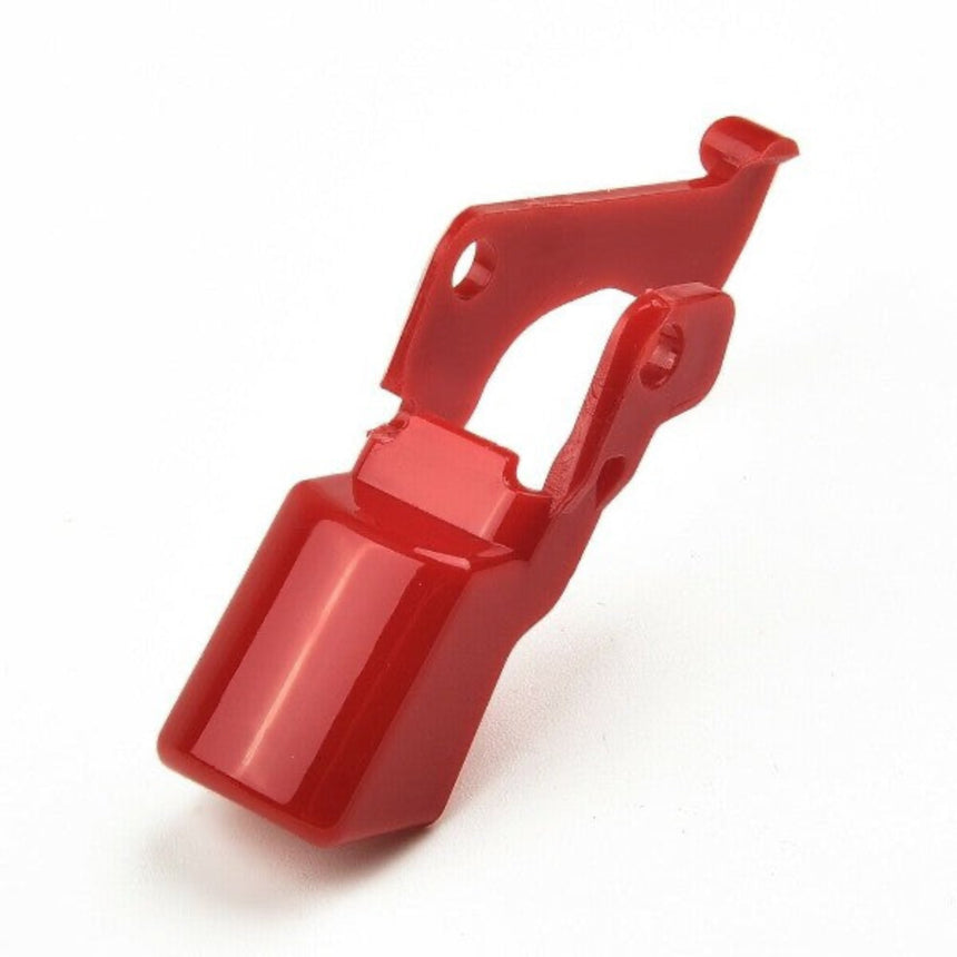 Red plastic component on a white background