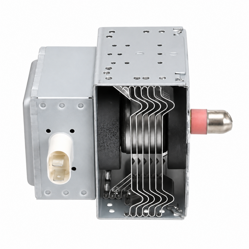 A metal microwave magnetron assembly with a silver outer casing, visible internal waveguide tubes, a black central component, and a pink connector on the right side, isolated on a white background.