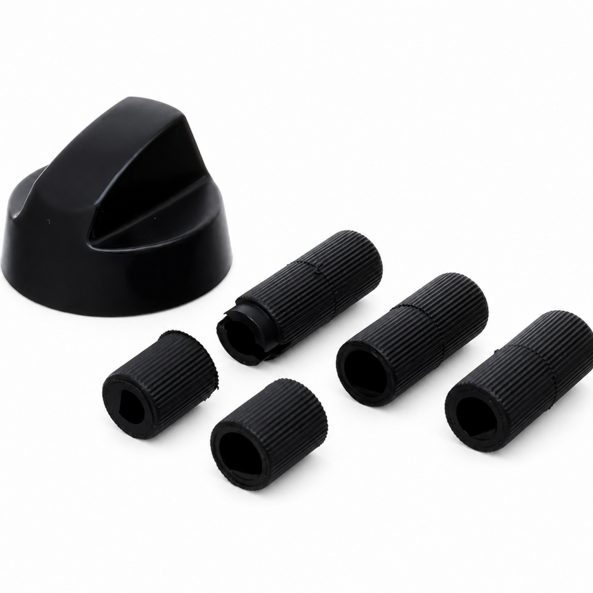 Set of black plastic components on a white background
