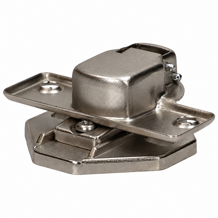 A stainless steel kitchen cabinet hinge with a brushed metallic finish, featuring a top plate with mounting holes and a central locking mechanism, shown on a plain white background.